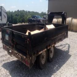 2007 Pj 14'  gooseneck deck over dump trailer with fold down sides. Also has ramps to haul skid loader